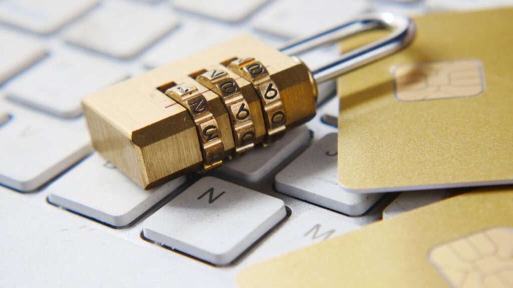 Golden lock with numbers on a laptop keyboard 