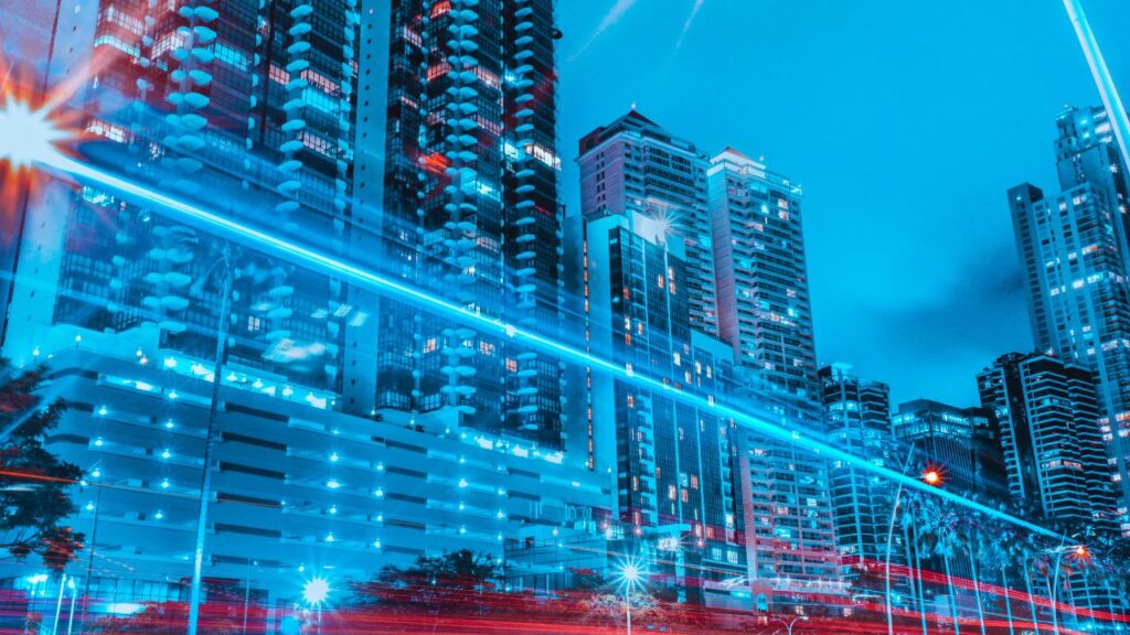 Blocks of modern and futuristic buildings depicting the use of smart building tech